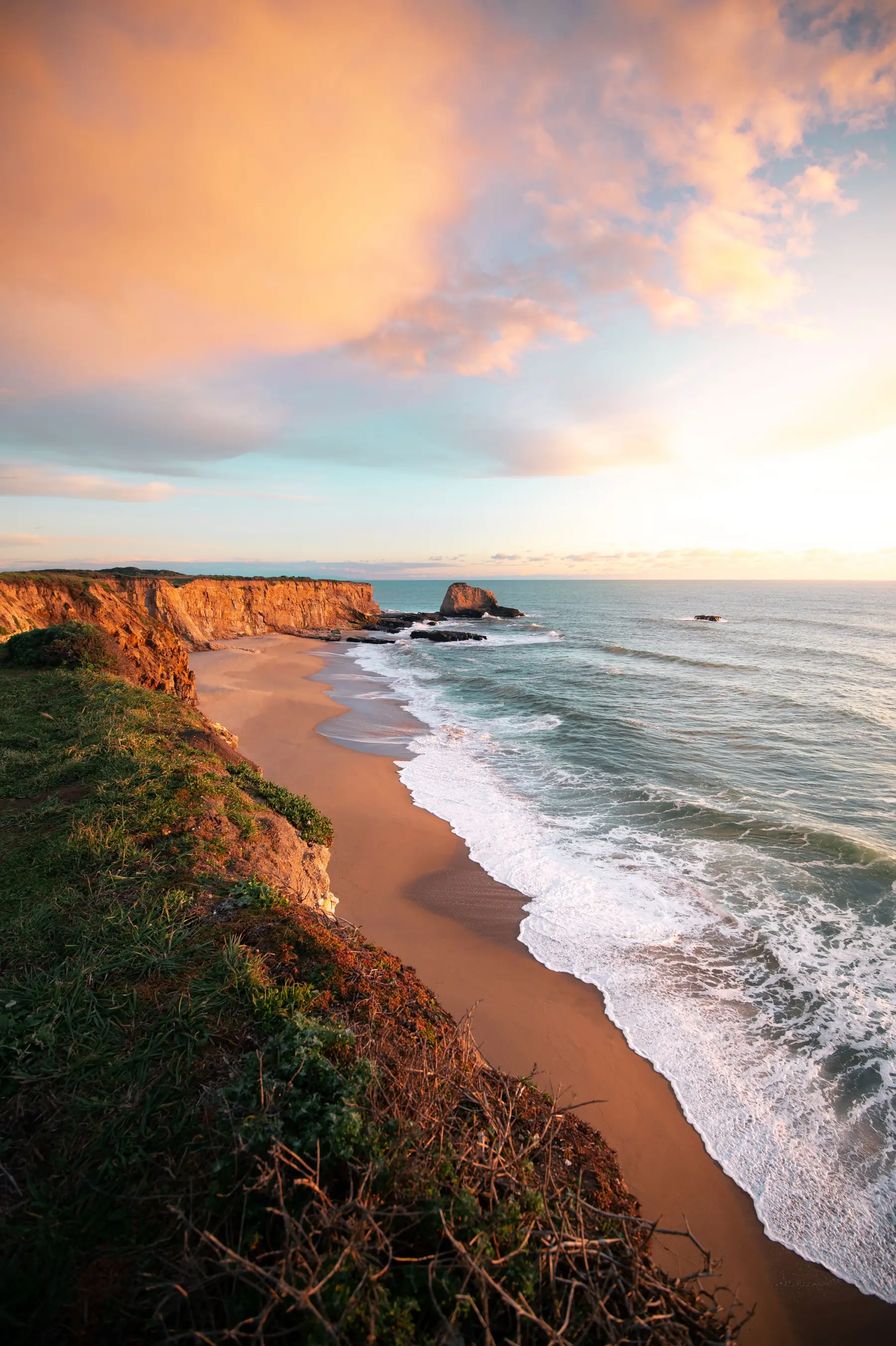 Coastal cliffs above the ocean at golden hour