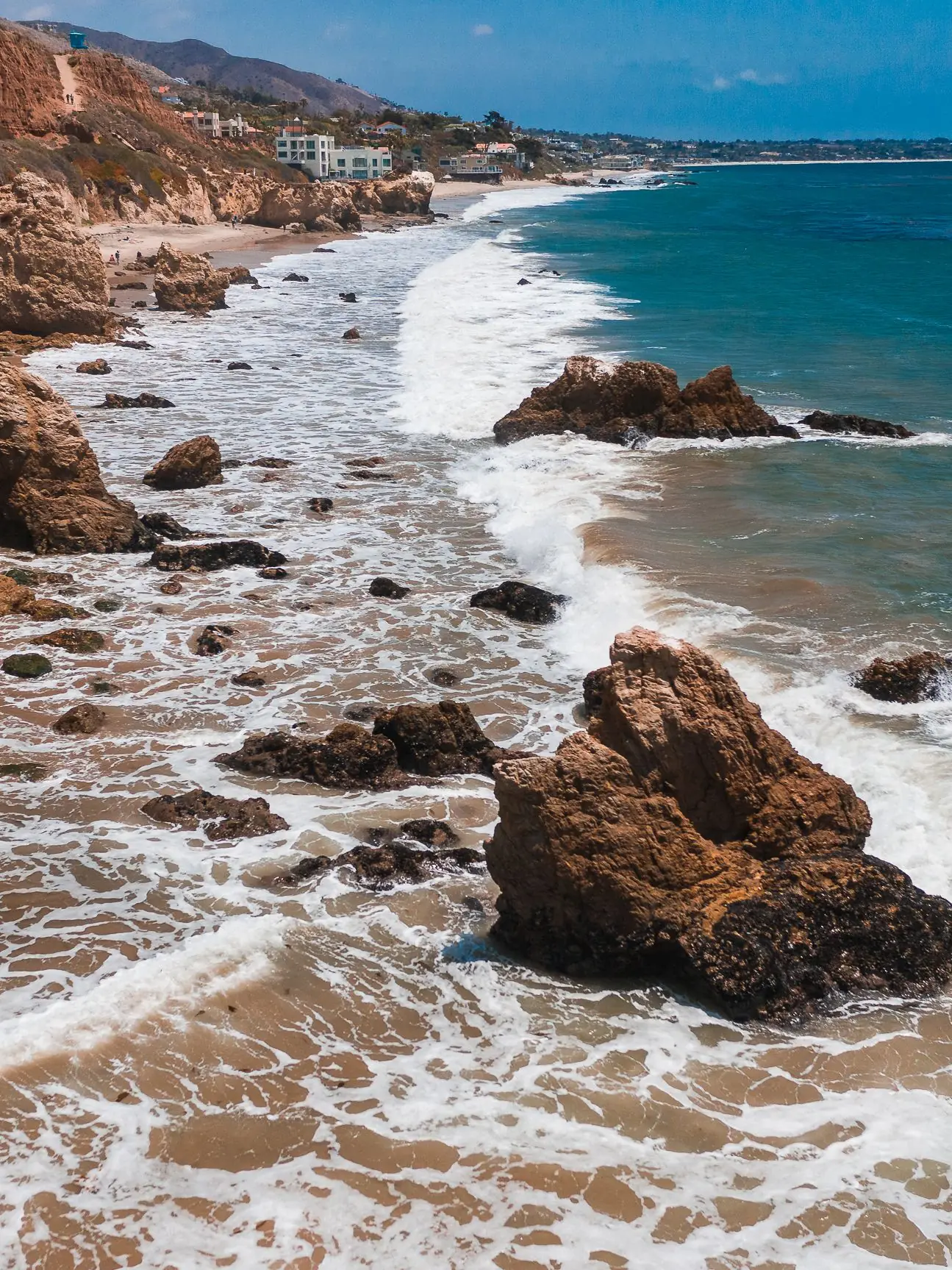 Surf breaking over rocks along the Malibu shoreline